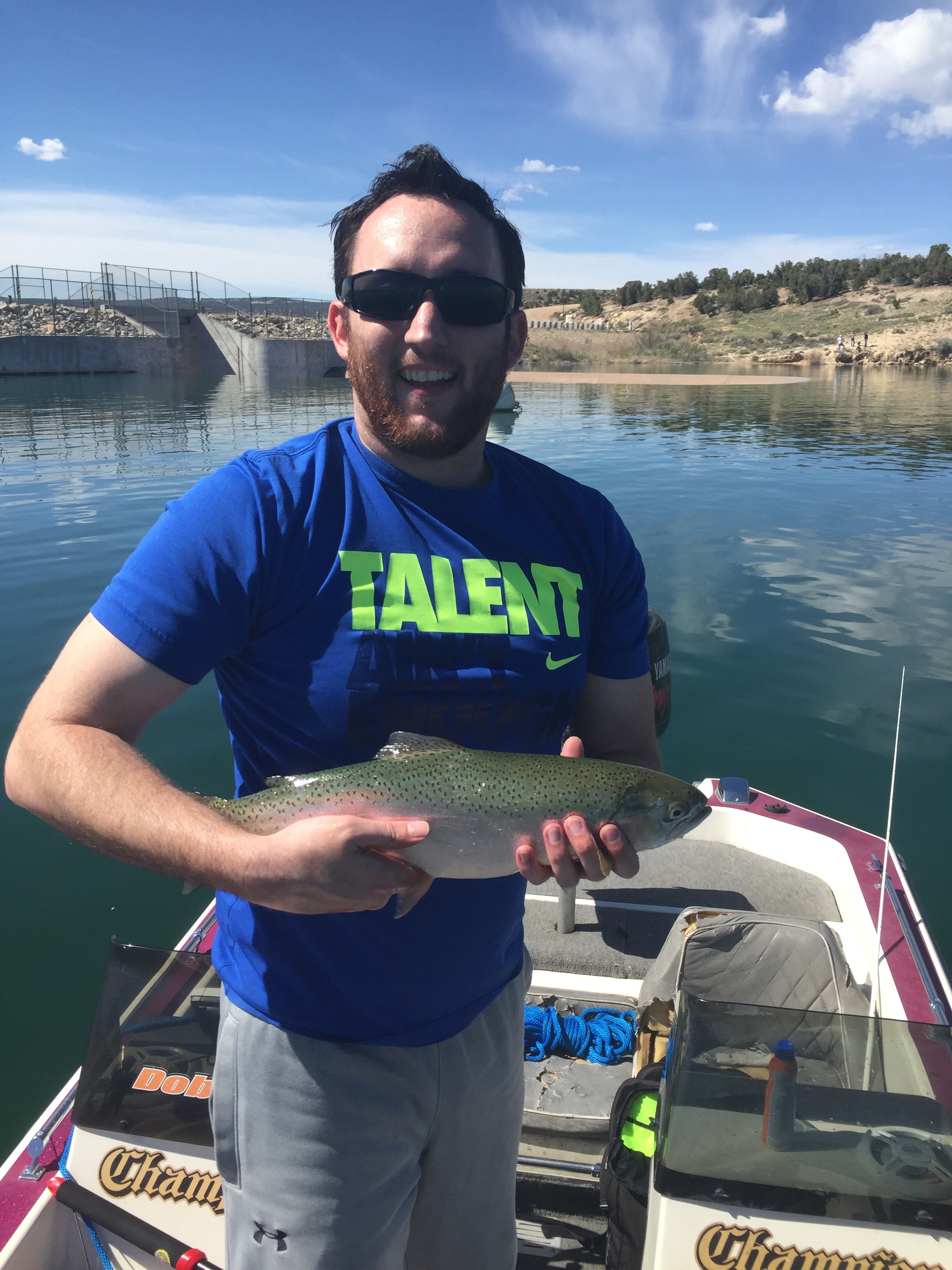 Angler holding up a rainbow trout caught at starvation reservoir