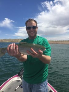 Image of angler holding up a rainbow trout caught at starvation reservoir